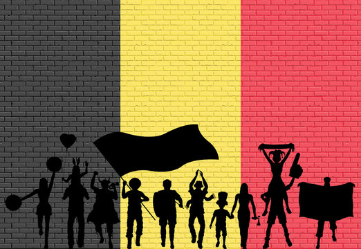 Belgian supporter silhouette in front of brick wall with Belgium flag