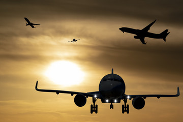 silhouette of planes in the sky