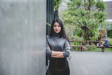Portrait of designer woman standing in front of small vintage store. Small business