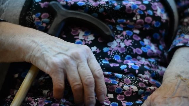 The hands of the elderly in a nursing home for the elderly and disabled. Close-up 