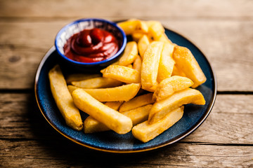French fries on wooden table