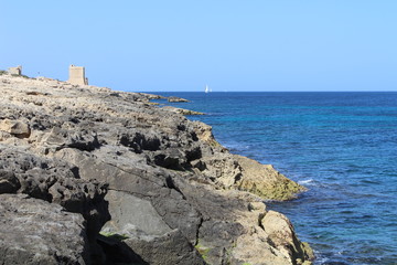 Tower on rocky beach, Marsacala, Malta 