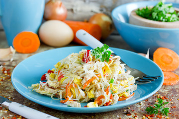 Chicken pad thai noodles with fried eggs, carrot, onion, pepper