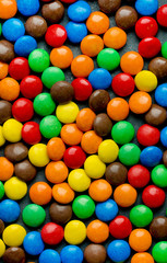 Fototapeta na wymiar Multi colored candy drops as a background