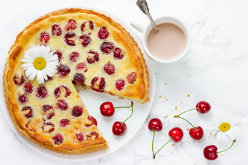 Cherry pie with cream filling, french dessert clafoutis with red sweet cherries