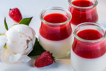 Light milk, dietary dessert with strawberries. Panna cotta. The concept of a healthy diet.
