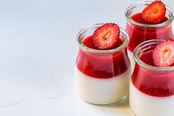 Light milk, dietary dessert with strawberries. Panna cotta. The concept of a healthy diet.