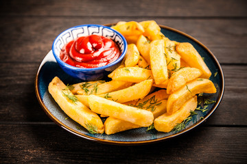 French fries on wooden table