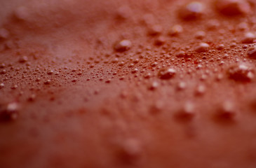 Macro shot of Pink raspberry, strawberry coconut smoothie with air bubbles. Detailed, Close up.