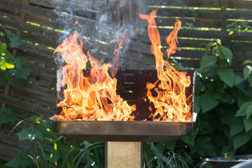 burning barbecue in the garden