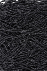 Black and gray woolen thread. View from above.