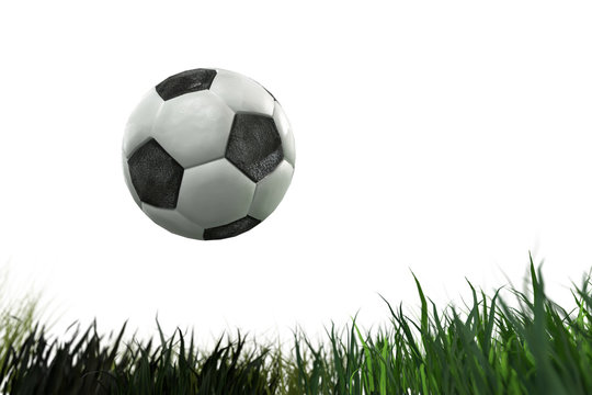 3D Illustration of a soccer ball on grass on white background
