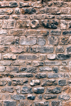 Background of antique stone wall texture vertical