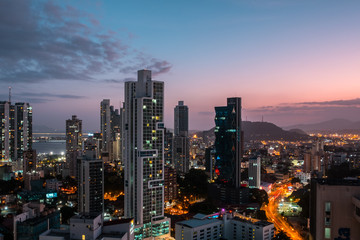 Fototapeta premium city skyline with sunset sky - skyscraper cityscape of Panama City