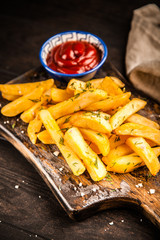 French fries on wooden table