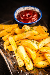 French fries on wooden table