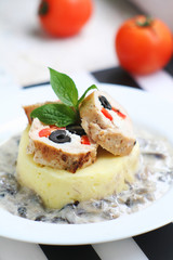 Meat rolls with mashed potatoes and mushroom sauce