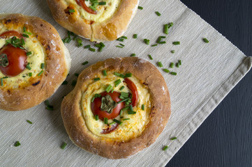 Homemade country cake with cheese and tomatoes.