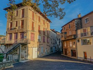 Fototapeta na wymiar Saint Affrique, Midi Pyrenees, France - September 24, 2017: Old hotel closed on a lonely street in a French village
