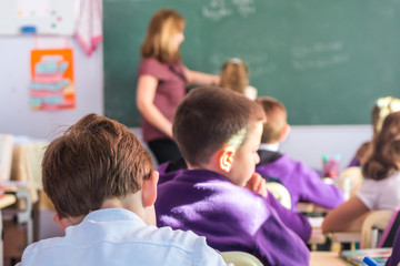 School children are participating actively in class. Lesson