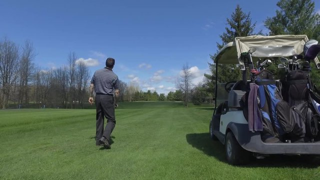 golfing man drives a ball slider view 4k smooth