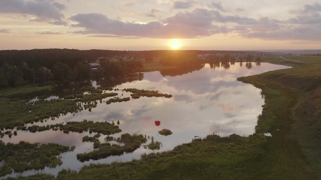 Aerial View. Flying over the beautiful autumn River insun rays. Aerial camera shot. Altai, Siberia 4k