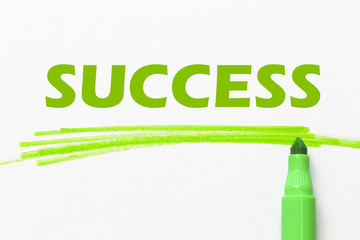 SUCCESS word written with green marker