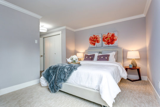 Light modern apartment bedroom with a bed view.