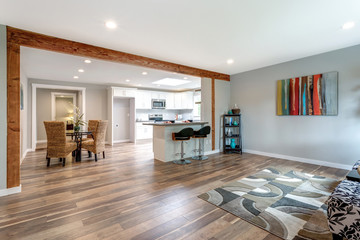 Open concept home interior with hardwood floor.
