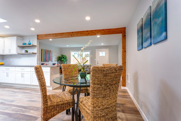 Light spacious dining area with wicker chairs.