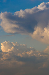 Landscape with dramatic light - beautiful golden sunset with saturated sky and clouds.