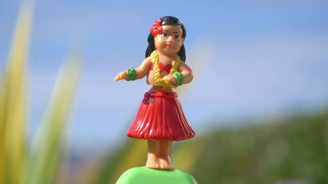Traditional hula dancer souvenir toy in 4K slow motion 60fps