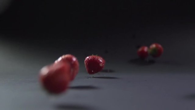 Berries of strawberries roll down into the chamber on the surface.