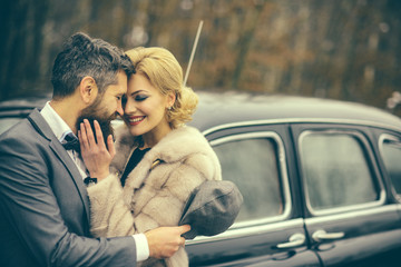 retro look of couple in love. retro car and happy couple in love outdoor.