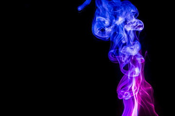 Obraz premium Colored smoke on black background