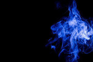 Blue smoke on black background