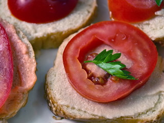 Sandwich with  tomato. Sandwich with pâté and tomato. A delicious sandwich. Food on the table