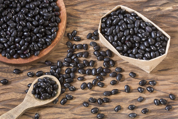 Black beans. Wooden background - Phaseolus vulgaris' Black turtle