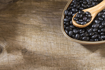 Black beans. Wooden background - Phaseolus vulgaris' Black turtle