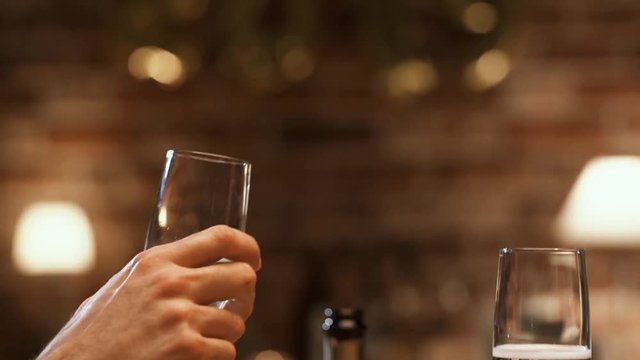Couple celebrating New Year's eve and toasting with wine