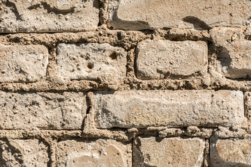 texture of the old wall of brick blocks, scattered brick and brickwork, architecture abstract background