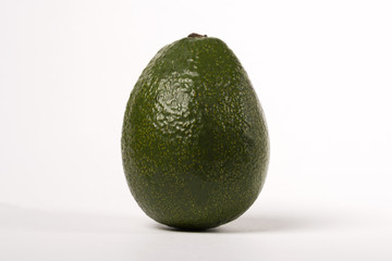 Green avakado on a white background.
