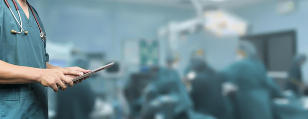 Medical and healthcare,Male doctor or medical students or surgeon,anesthesiologists using digital tablet during the conference,Health Check with digital system support for patient,background banner