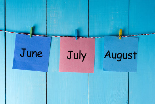 Three Summer Month - June, July And August - On Notes Pinned At Wooden Wall. Summer Calendar Concept