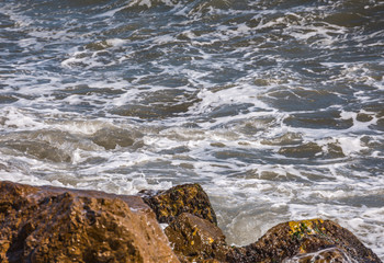 Amazing sea with blue summer wave and rocks, relaxing view of rocks and water