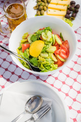 Summer salad with olives, tomatoes and cheese
