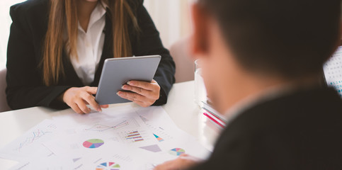 businesswoman working with modern devices, student girl using digital tablet computer and mobile smart phone,business concept,selective focus,vintage color