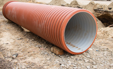 Large orange plastic pipes for sewerage system
