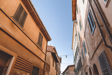 Fototapeta na wymiar buildings on street in old city, Pisa, Italy