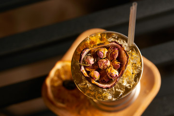 Mariachi cocktail on bar table. Freshness alcoholic beverage drink with Tequila, Luxardo, Grapefruit juice, Kurkuma syrup, Egg white ingridients, close-up.  Tart cocktail refreshing with citrus flavor